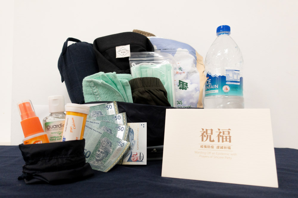 Care packages containing a number of essential items and some cash are prepared by the social workers of Charity Development Department after assessing the situation faced by the foreign workers. (Photo by Chen Ya Yin)